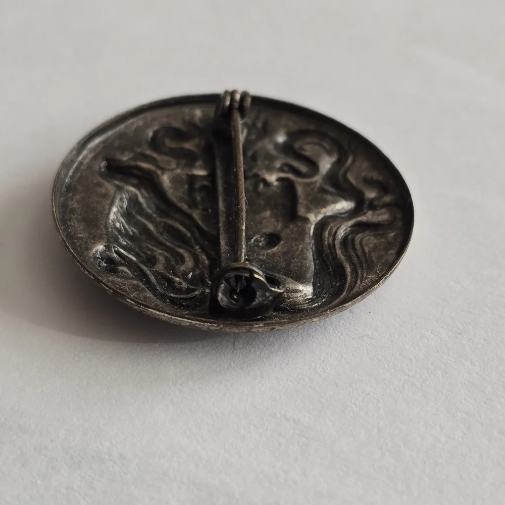 Art Nouveau style brooch woman with flowing hair dark silver tone pin